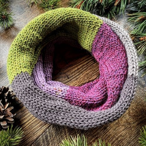 Knitted block stripe double infinity scarf in green pink and taupe grey