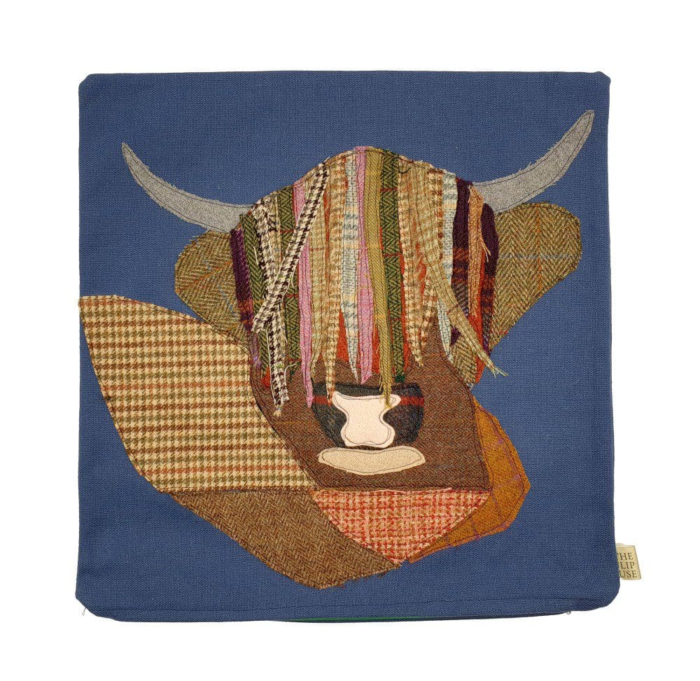 Applique Highland Cow cushion on denim blue cotton cover