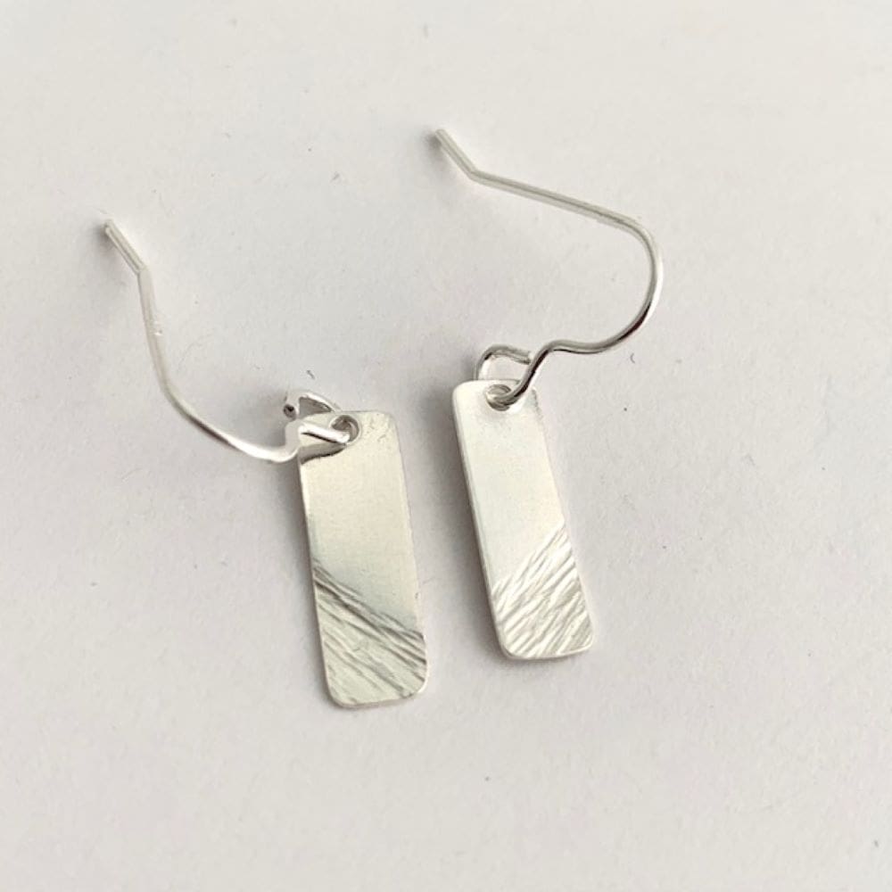 Part plain and-part hammered silver bar earrings