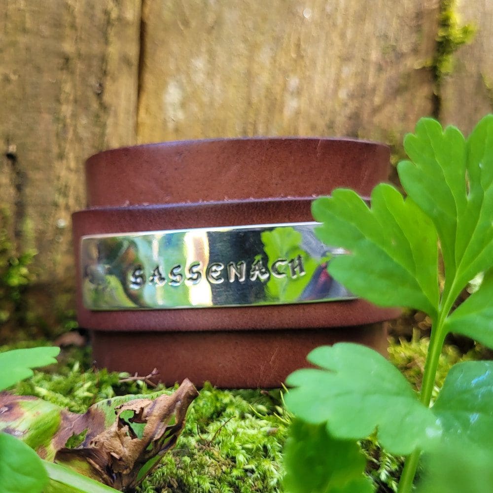 silver and leather wide wrist band