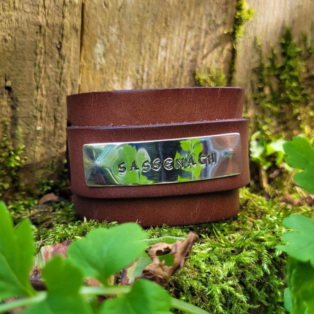 silver and leather wide wrist band