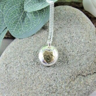 Silver_Pebble_Necklace_With_Brass_Heart