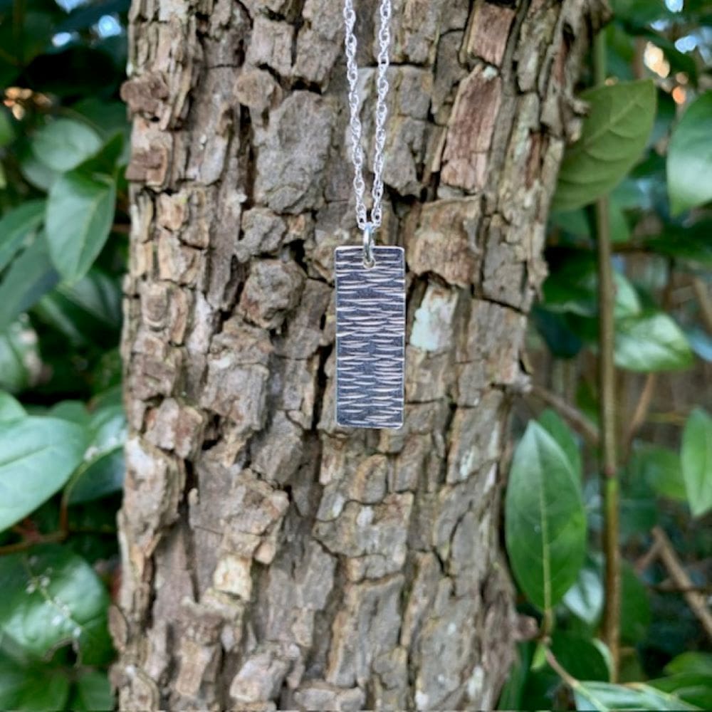 Sterling silver line hammered rectangle pendant