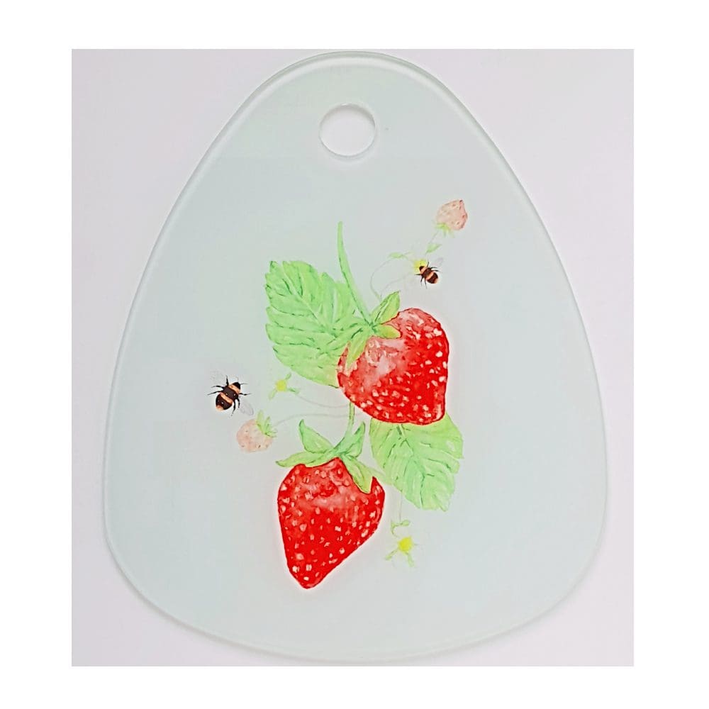 Droplet shaped Glass Chopping Bpard featuring Strawberry & Bees artwork