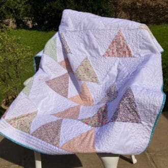 White and floral child's quilt