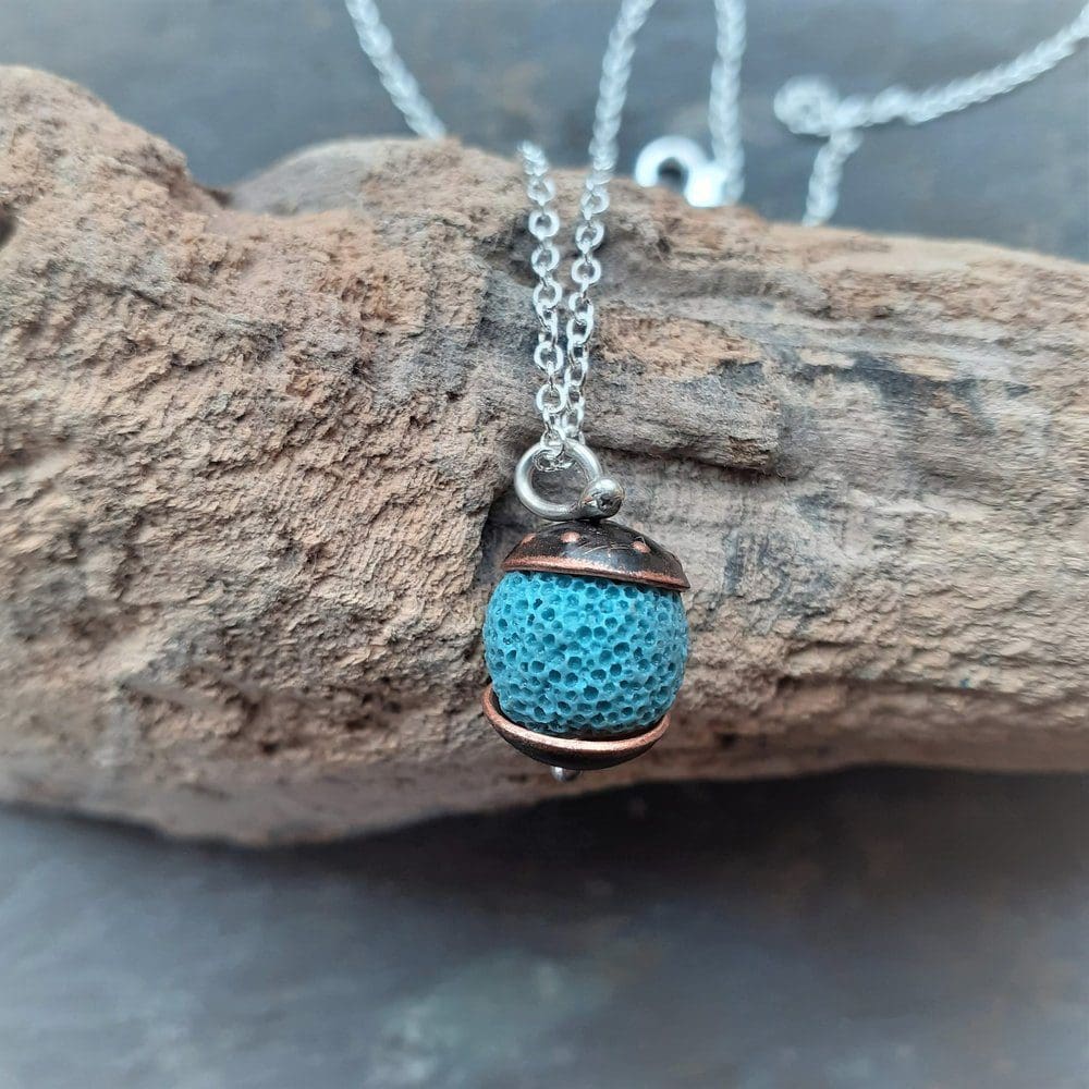 copper and blue lava rock bead necklace on a silver chain