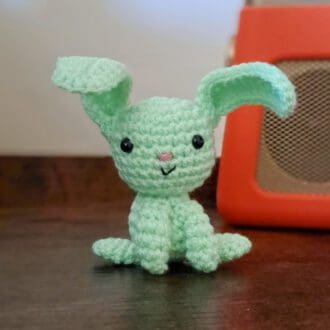 Green rabbit soft sculpture figure