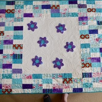 White purple teal flower child's quilt