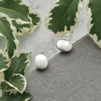 Oval shaped Argentium® silver pebble stud earrings with a soft brushed silver finish