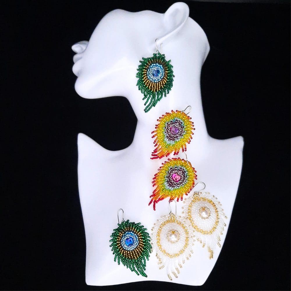 Beaded peacock feather earrings. White, natural green and rainbow colours.