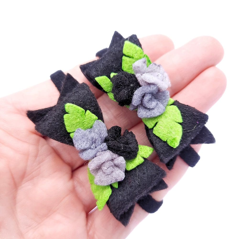 Black and grey bows and roses set on a hair elastic