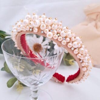 Wide band headband covered in cream pearls and sparkly crystals