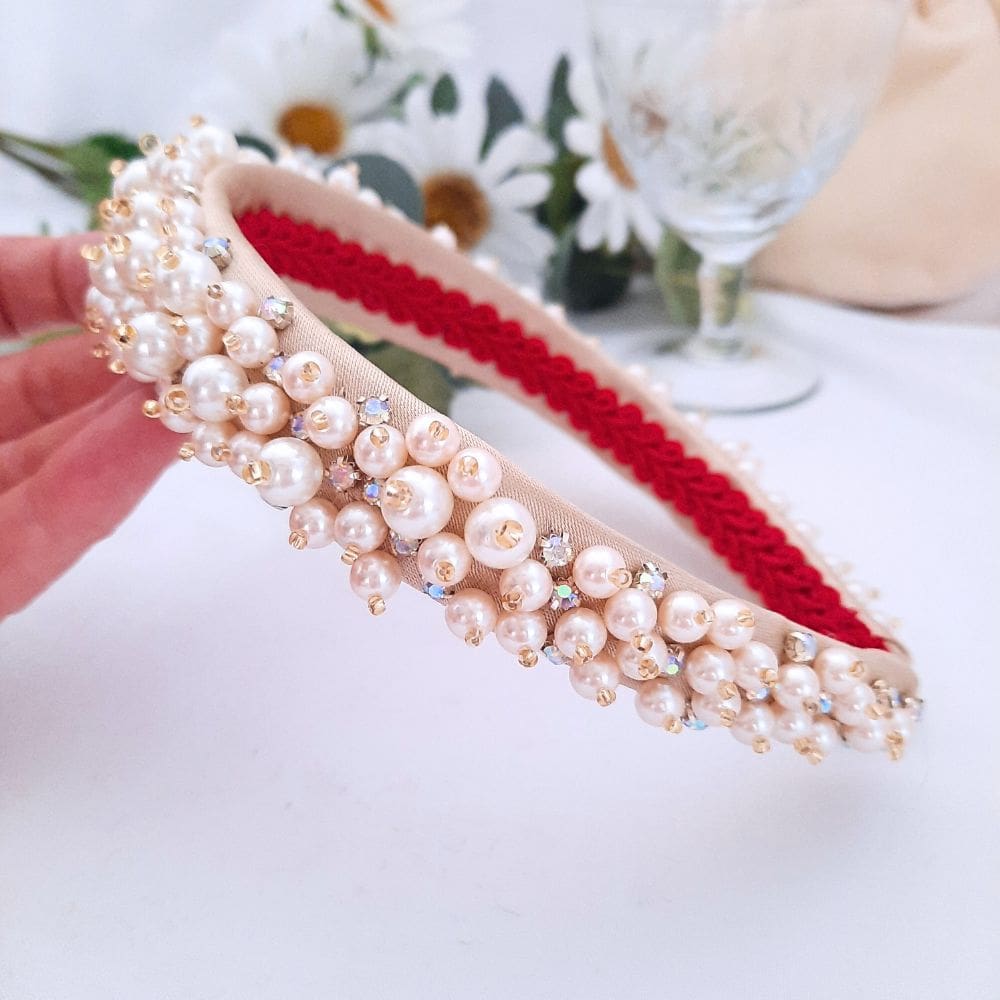 Wide band headband covered in cream pearls and sparkly crystals