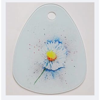 Glass cutting board featuring Daisy artwork
