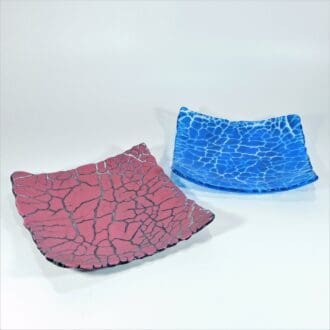 Two fused glass dishes with interesting crackle effect, one pink and the other blue