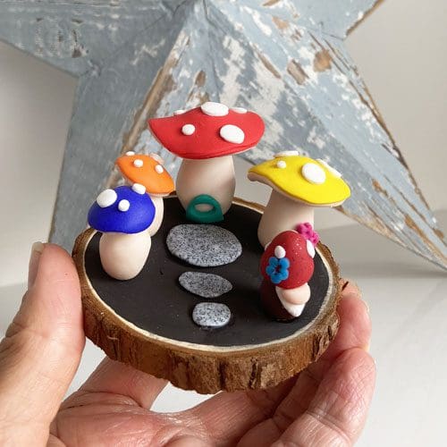 Handmade polymer clay toadstool and gnome quirky ornament on log slice