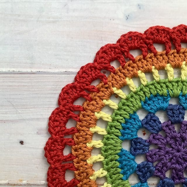 Crocheted rainbow mat quadrant.