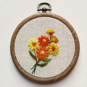 Needle felted orange and yellow flower picture