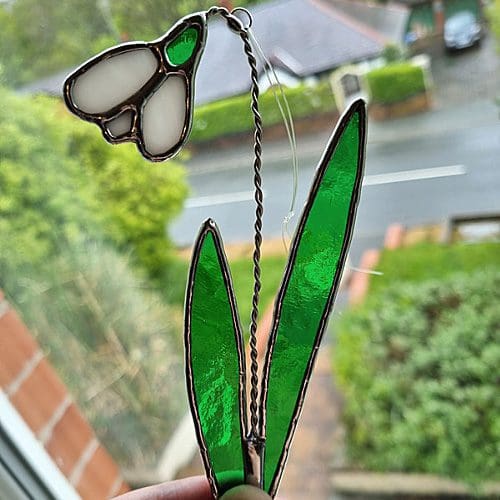 Stained glass Snowdrop suncatcher in the window