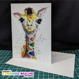 A6 Greetings card featuring the head and shoulders of a colourful Giraffe.