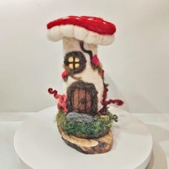 needle felted toadstool fairy house with red top