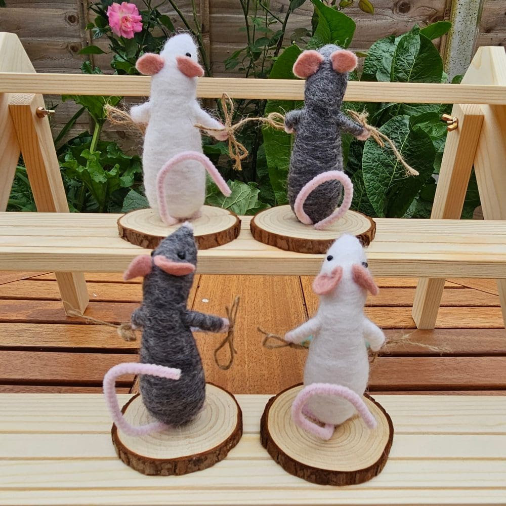 Back view of Needle felted mice holding bead names
