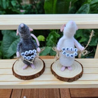 needle felted mice holding well done bead sign