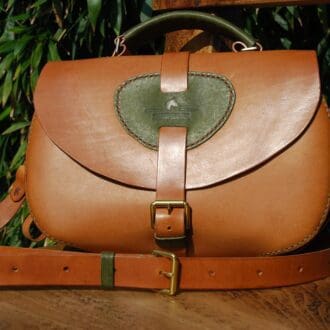 Handmade Italian leather handbag with adjustable strap and buckle fastening