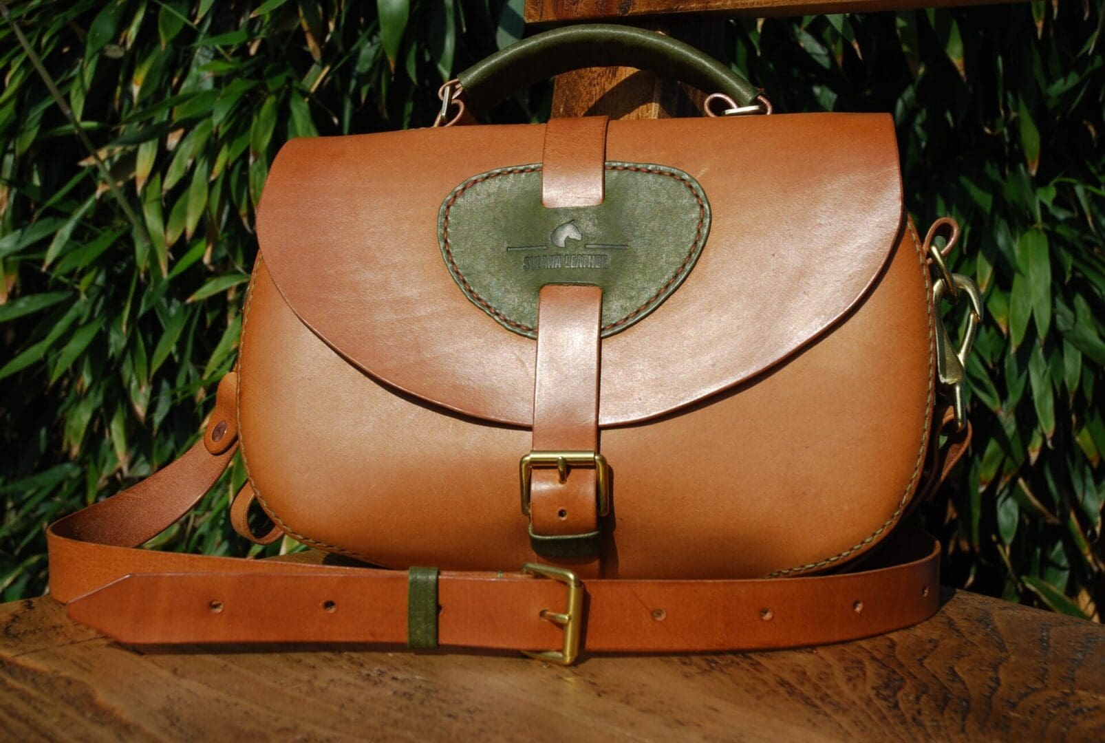 Handmade Italian leather handbag with adjustable strap and buckle fastening