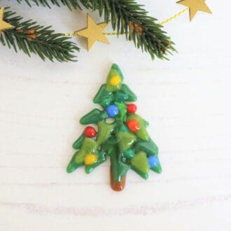 Handmade fused glass Christmas tree brooch with colourful frit baubles