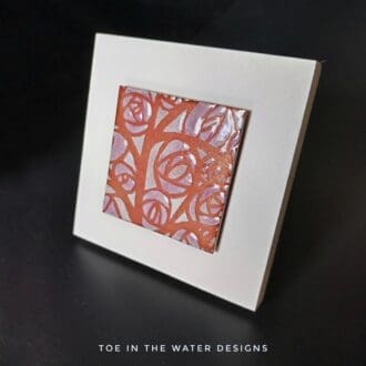 copper enamelled tile in pink and white
