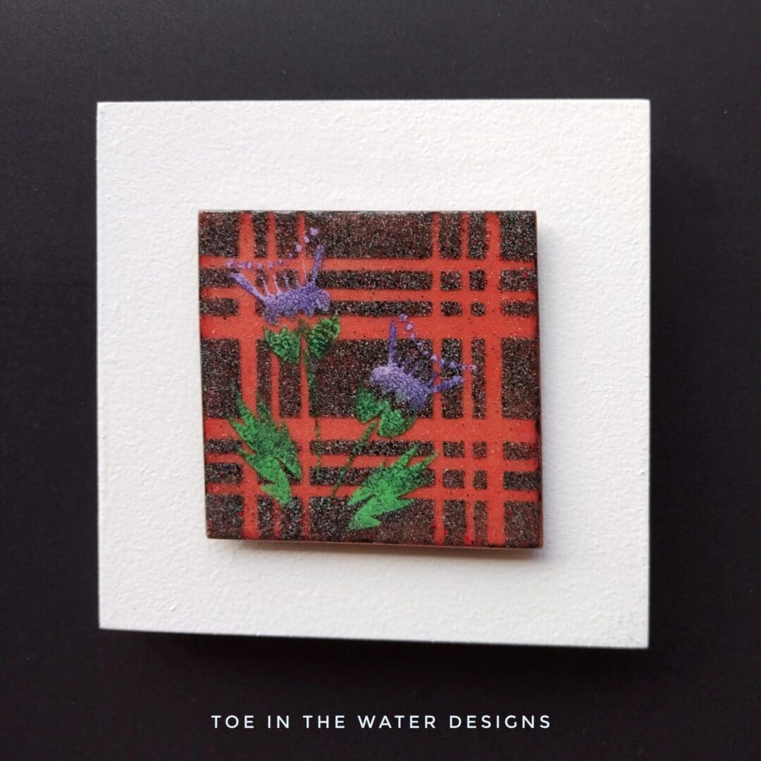 copper enamelled tile in tartan with thistles