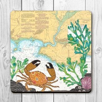 Coaster printed with textile art design of a crab on an old sea chart