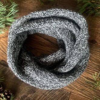 Simple soft knitted infinity scarf in grey marl