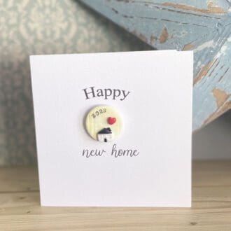 New home card with a single handmade clay magnet