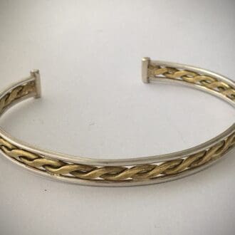 silver bangle with central brass twist