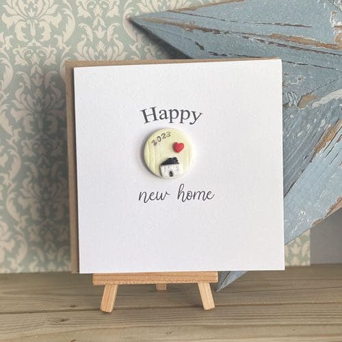 New home card with a single handmade clay magnet