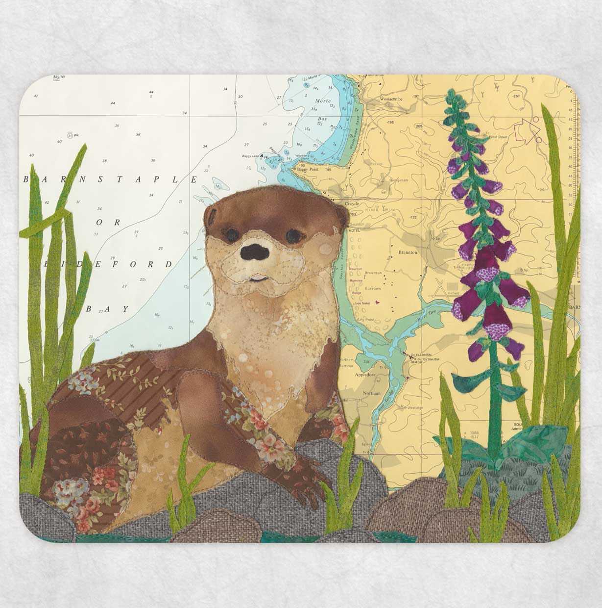 Placemat printed with a textile art design of an otter on an old sea chart