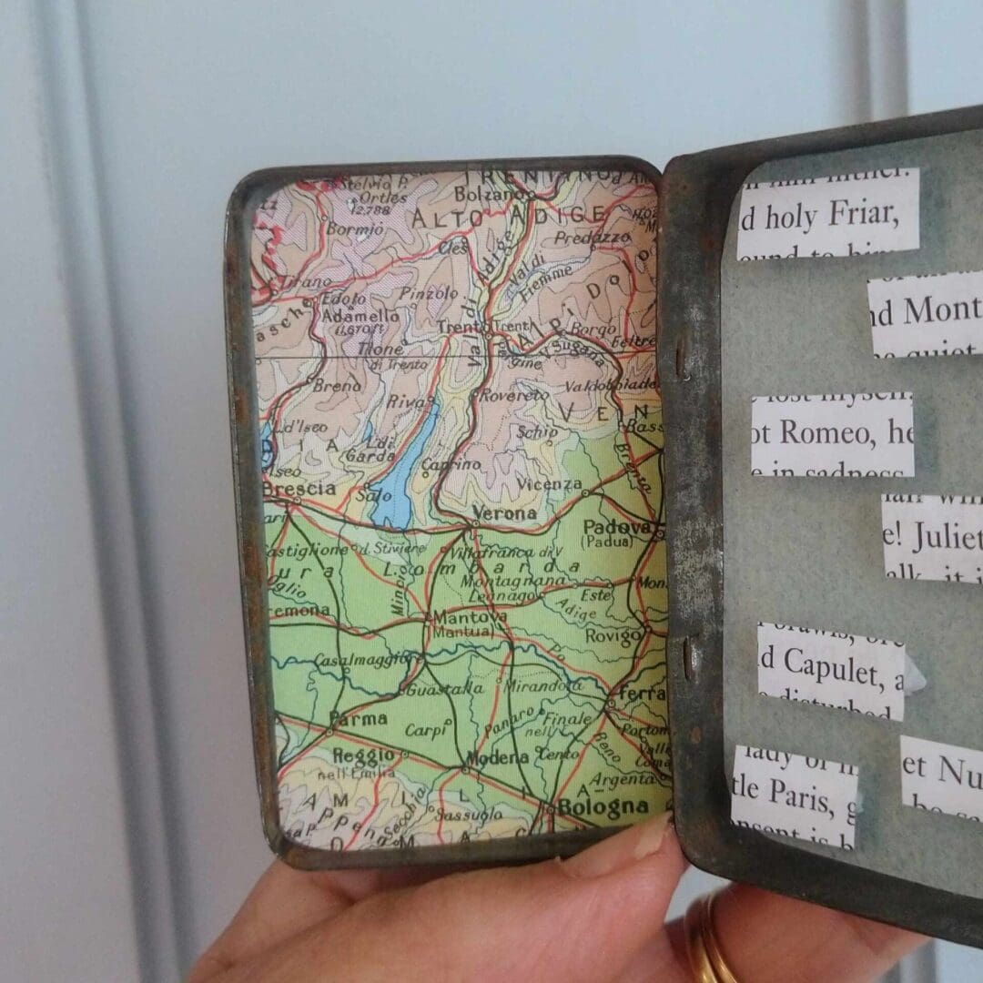 Close up of Italy map inside Romeo and Juliet story tin