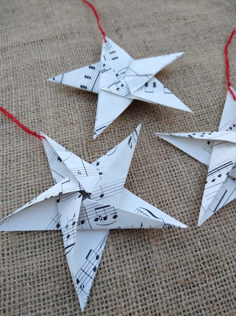 Three sheet music origami hanging star decorations