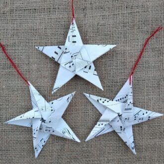 Three handmade origami music star decorations