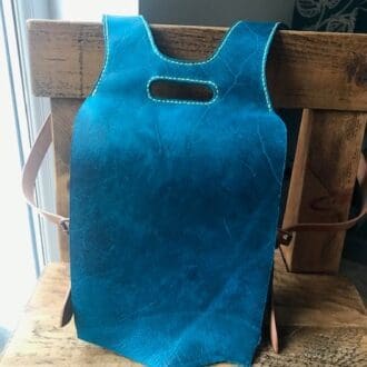 Blue English leather handmade ladies backpack with adjustable straps and two pockets