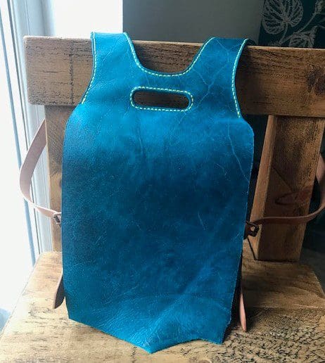 Blue English leather handmade ladies backpack with adjustable straps and two pockets