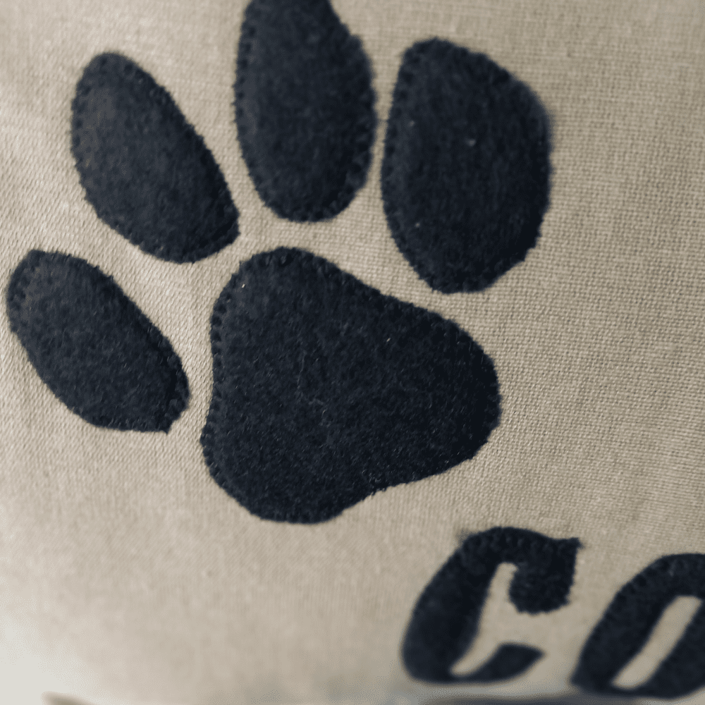 custom dog cushion black paw detail