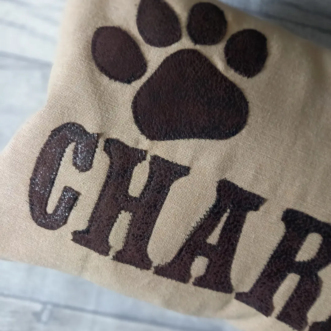 dog custom cushion paw and brown letter detail