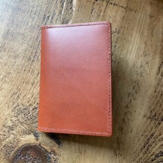 Italian leather passport, journal, field notes cover with room for cash and cards.