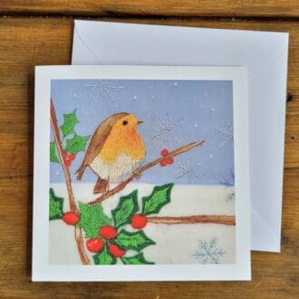 Luxury Christmas card print of embroidery of robin in holly bush and snowflakes 6 x 6 inches.