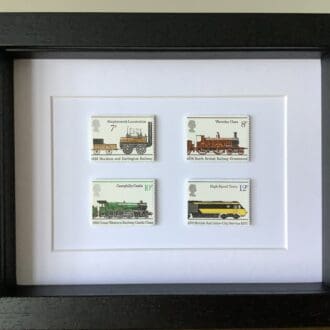 Four railway engine stamps in frame