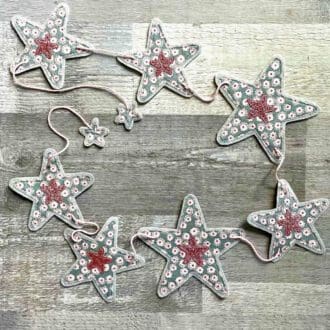 Grey ditsy floral christmas garland bunting with pink glitter star flags