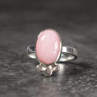 One of a Kind artisan Argentium Silver ring with a powder pink opal gemstone. Hand forged pebbles of Argentium Silver have been fused to the opals setting to make the perfect boho cocktail ring that no one else will have.